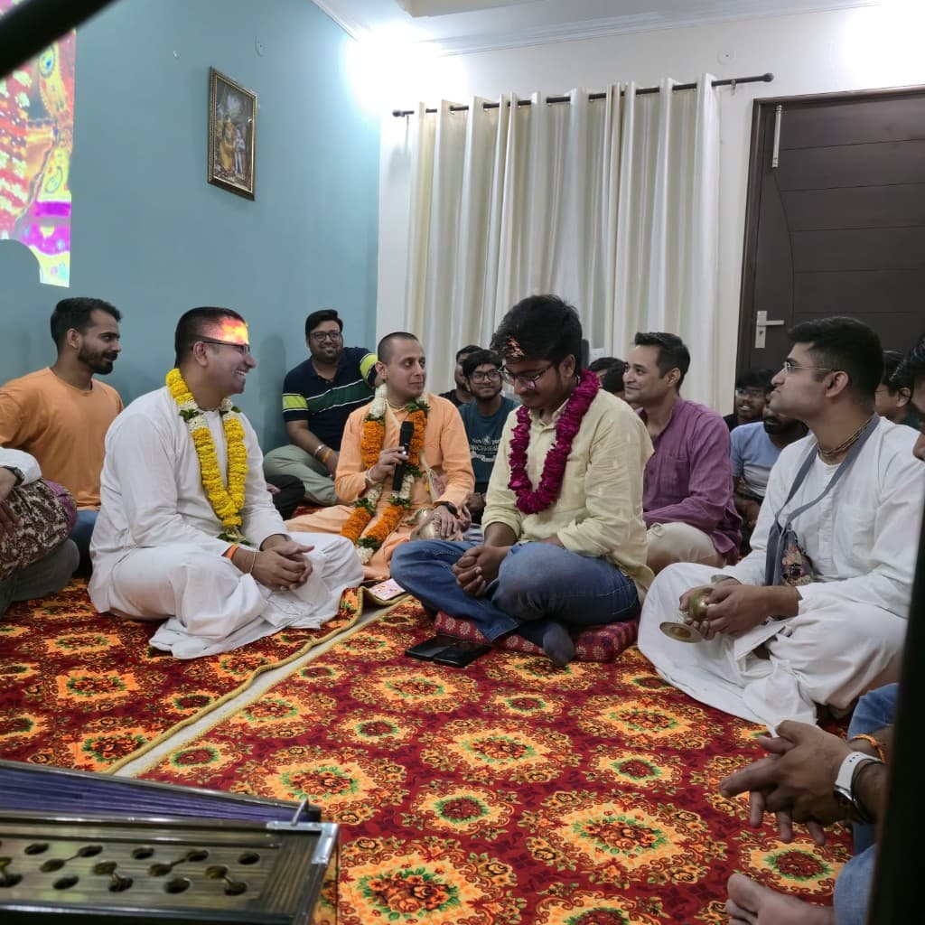 A welcoming ceremony at BACE - garlands, kirtan, and shared celebration with the community
